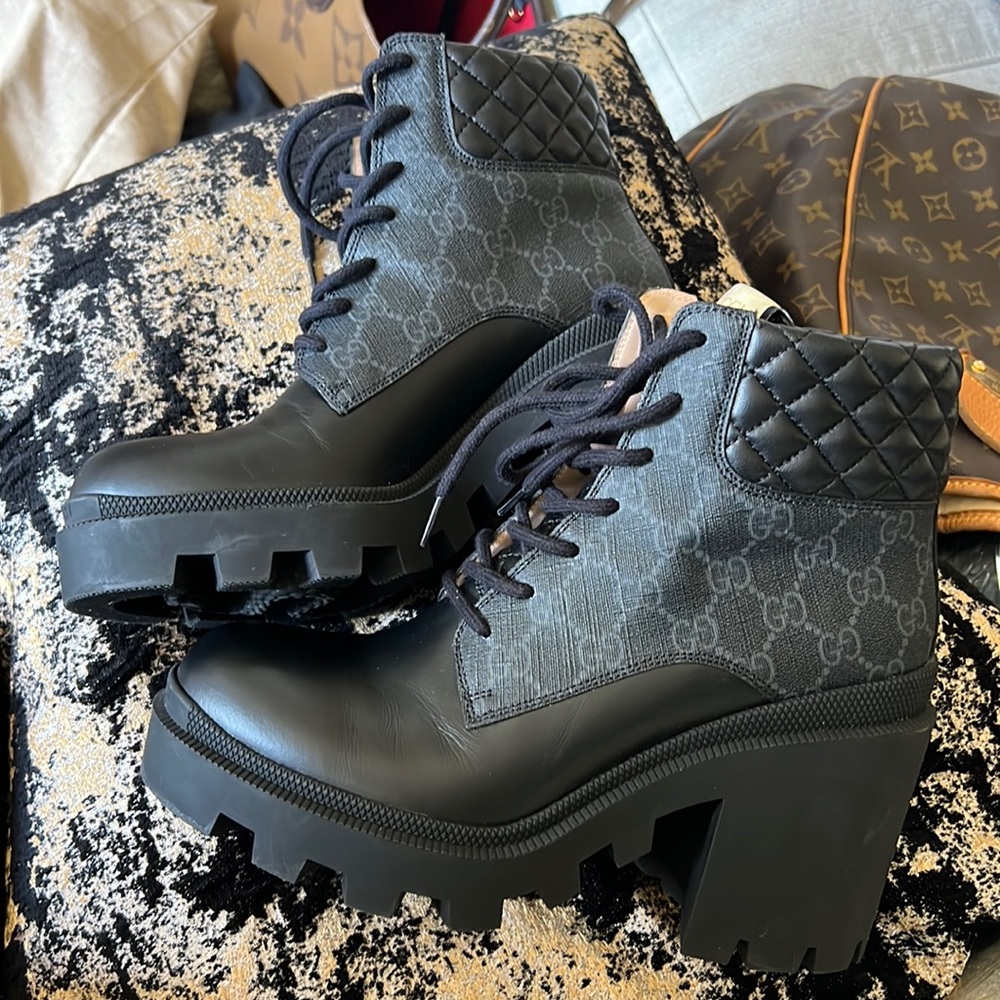 Black and gray Gucci combat boots